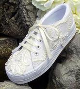 Children's ivory bridal wedding tennies with lace, pearls, and ribbon